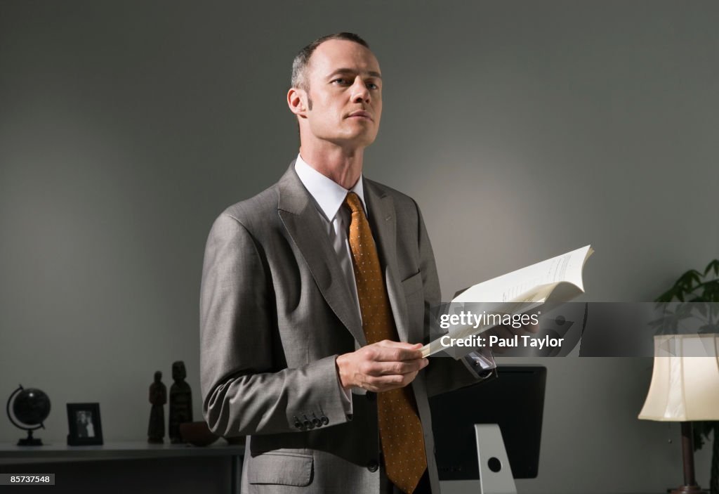 Businessman in office with document