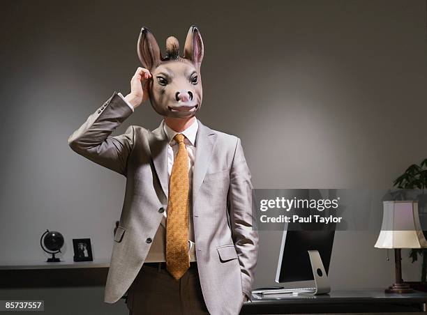 businessman in donkey mask - asino animale foto e immagini stock