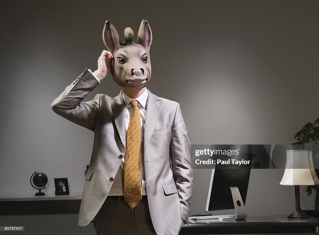 Businessman in donkey mask