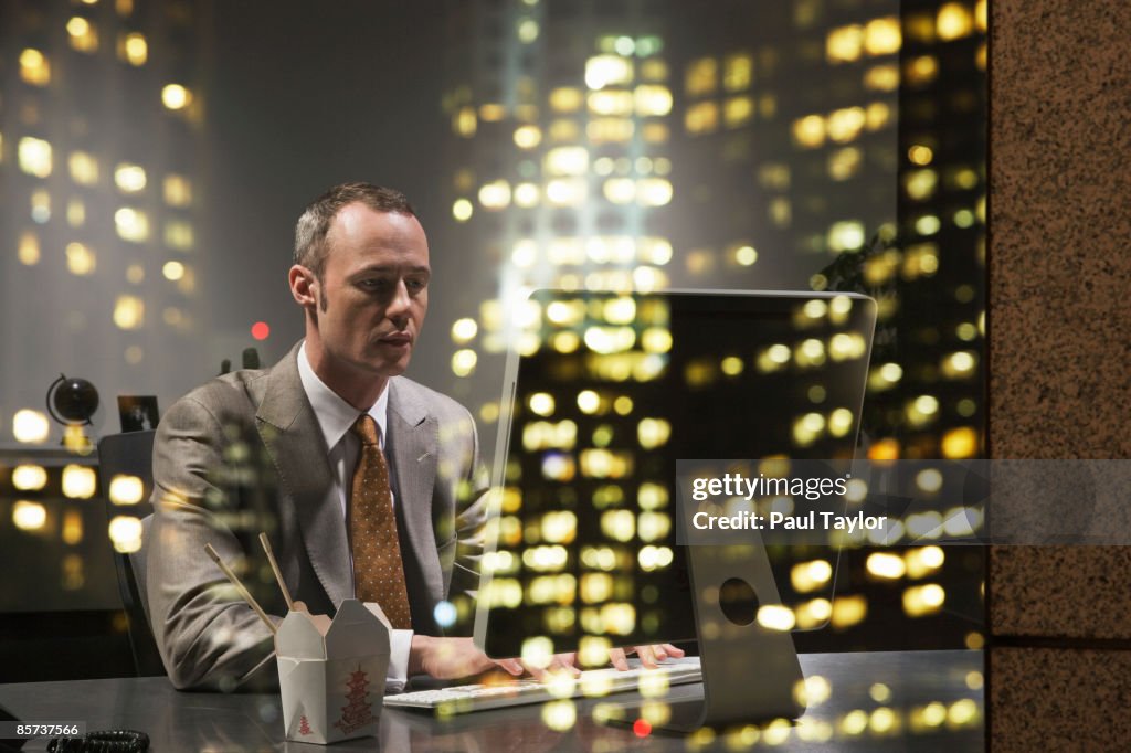 Businessman in office with reflection