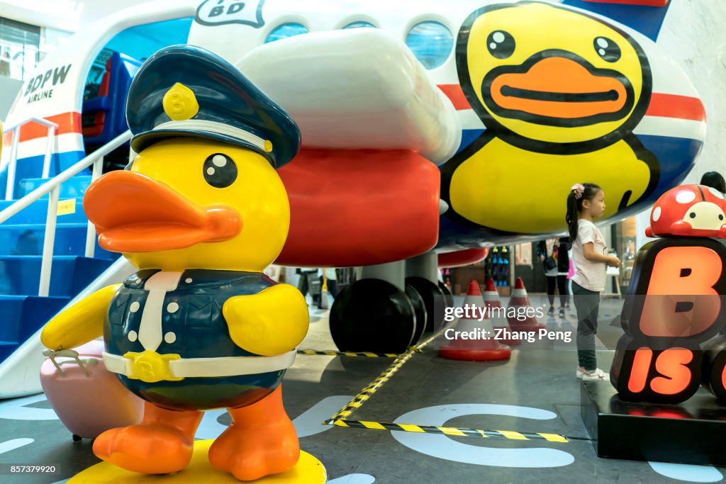 B.Duck's show platform is decorated as an cartoon airport...