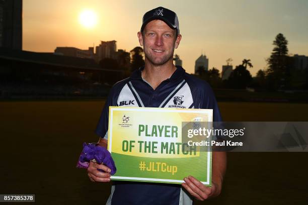 Cameron White of the Bushrangers poses with the Player of the Match award after winning the JLT One Day Cup match between Victoria and Tasmania at...