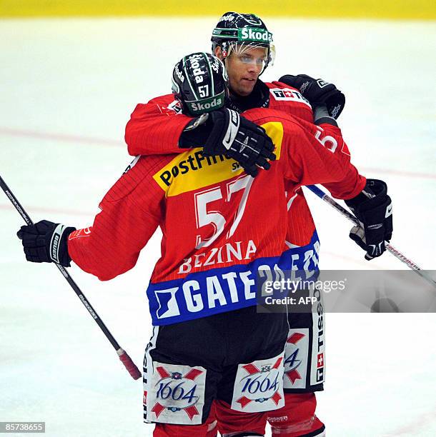 Ryan Gardner is congratulated by Goran Bezina after the Swiss 2-1 goal in the friendly ice hockey match between Sweden's Tre Kronor and Switzerland...