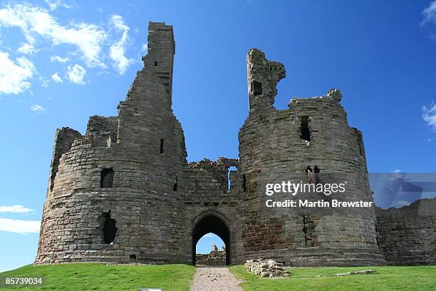dunstanburgh castle - old ruin stock pictures, royalty-free photos & images