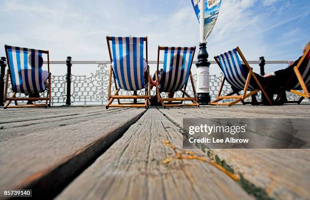nice day for it - brighton deckchair stock pictures, royalty-free photos & images