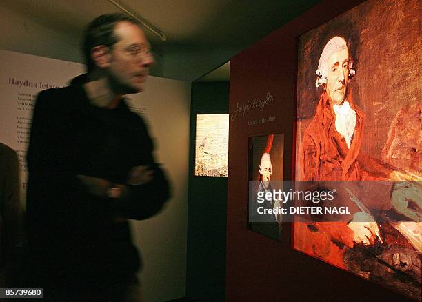 Simon Morgan This file picture shows visitors walking pass a portrait of Austrian composer Joseph Haydn during the opening of an exhibition "Haydn´s...