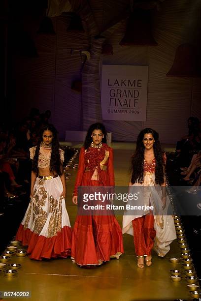 Models Vipasha Agarwal, Indrani Dasgupta and Amrit Maghera walk the runway at the Anamika Khanna show during the Lakme India Fashion Week...