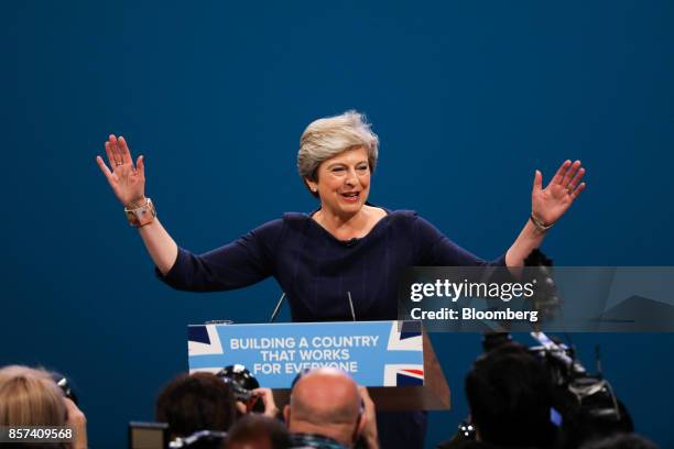 Theresa May, U.K. Prime minister and leader of the Conservative Party, gestures as she arrives to deliver her speech at the party's annual conference...