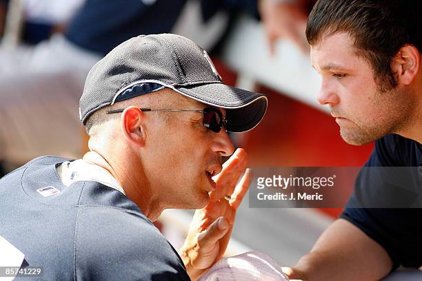 Manager Joe Girardi of the New York Yankees talks with pitcher Joba Chamberlain during a Grapefruit League Spring Training Game against the...
