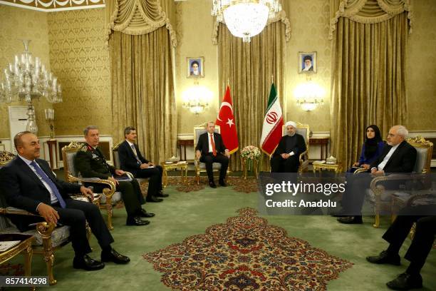 President of Turkey Recep Tayyip Erdogan and Iranian President Hassan Rouhani are seen with Chief of the General Staff of the Turkish Armed Forces...