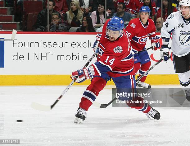 Tomas Plekanec of the Montreal Canadiens shoots the puck against the Tampa Bay Lightning at the Bell Centre on March 26, 2009 in Montreal, Quebec,...