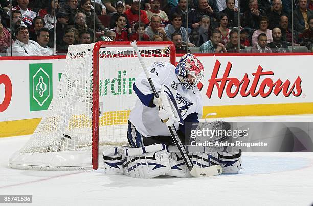 Karri Ramo of the Tampa Bay Lightning makes a save against the Montreal Canadiens at the Bell Centre on March 26, 2009 in Montreal, Quebec, Canada.