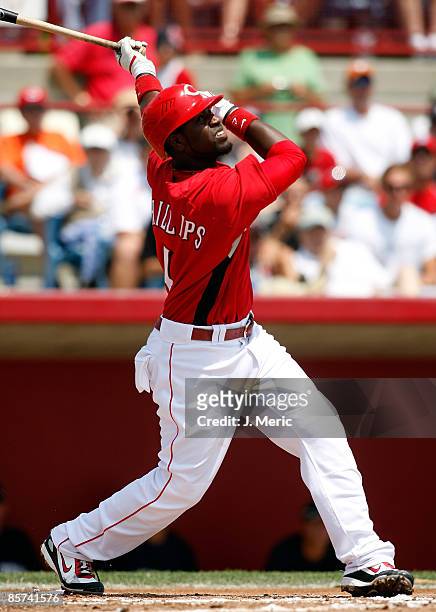 Infielder Brandon Phillips of the Cincinnati Reds fouls off a pitch against the New York Yankees during a Grapefruit League Spring Training Game at...