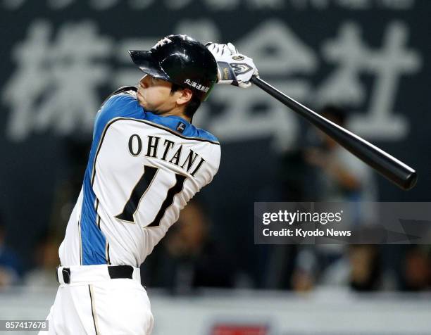 Nippon Ham Fighters starting pitcher Shohei Otani hits safely as cleanup hitter during the fourth inning of a game against the Orix Buffaloes at...