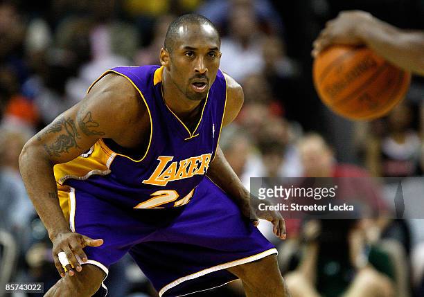 Kobe Bryant of the Los Angeles Lakers prepares to play defense against the Charlotte Bobcats during their game at Time Warner Cable Arena on March...