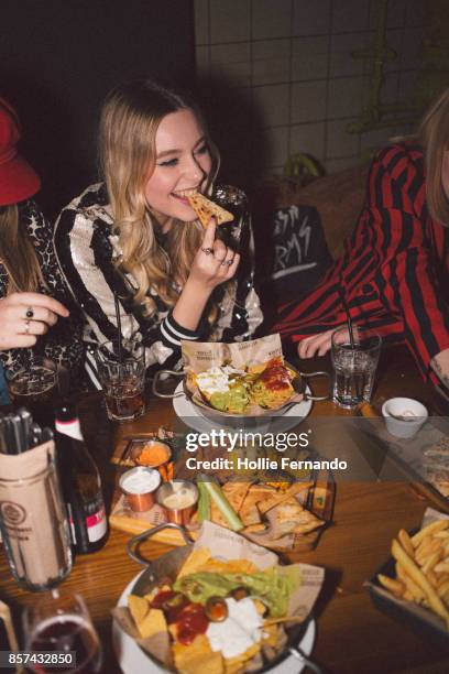 girlfriends on a night out - eating with friends stock pictures, royalty-free photos & images