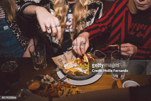 girlfriends on a night out - tortilla chip stock pictures, royalty-free photos & images