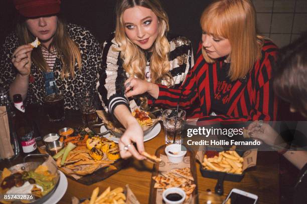 girlfriends on a night out - restaurant atmosphere stock pictures, royalty-free photos & images