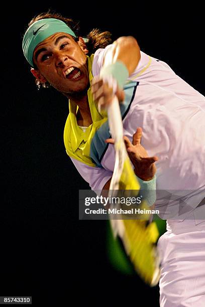 Rafael Nadal of Spain serves against Stanislas Wawrinka of Switzerland during day nine of the Sony Ericsson Open at the Crandon Park Tennis Center on...