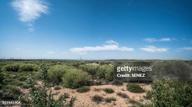 high angle view of field and mountains against sky - ordos city stock pictures, royalty-free photos & images