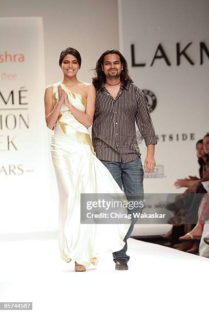 Designer Rahul Mishra walks the runway with Miss India Parvathy Omanakuttan at the Rahul Mishra show at Lakme India Fashion Week Autumn/Winter 2009...