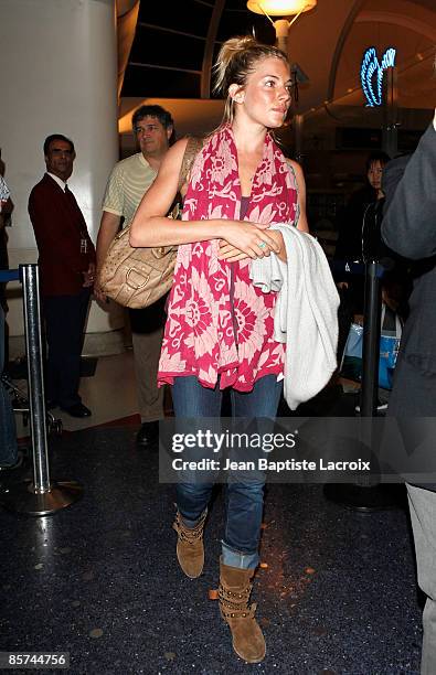 Sienna Miller arrives at LAX airport on March 31, 2009 in Los Angeles, California.