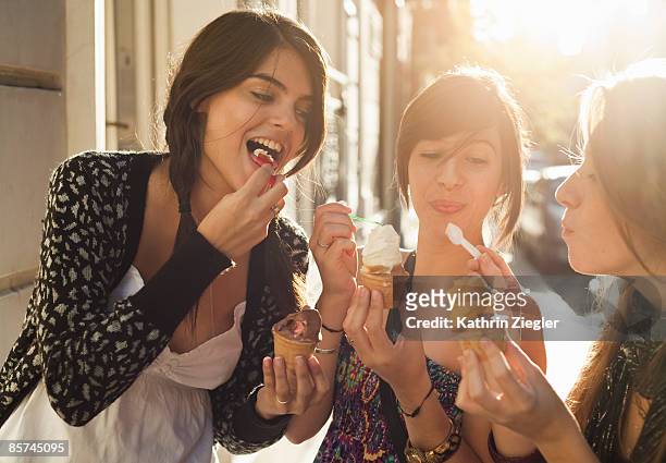 three girlfriends eating icecream