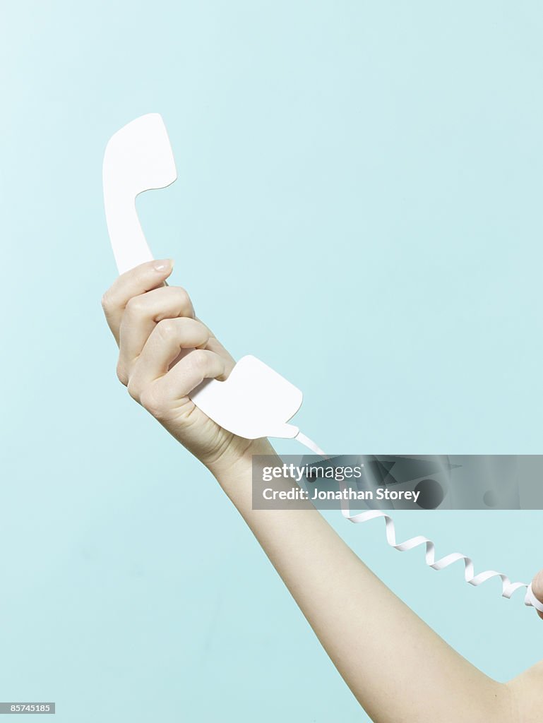 Holding paper telephone