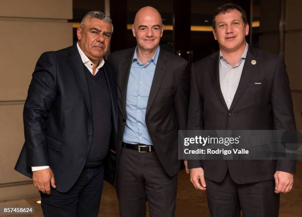 Claudio Chiqui Tapia president of AFA, Gianni Infantino president of FIFA and Alejandro Dominguez president of CONMEBOL pose for a photo as they...