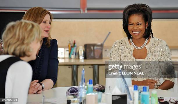 First Lady Michelle Obama and Sarah Brown, wife of British Prime Minister Gordon Brown, talk to staff and patients as they visit Maggie's Cancer...