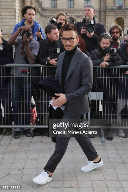 Former football player, Hidetoshi Nakata attends the Louis Vuitton show as part of the Paris Fashion Week Womenswear Spring/Summer 2018 on October 3,...