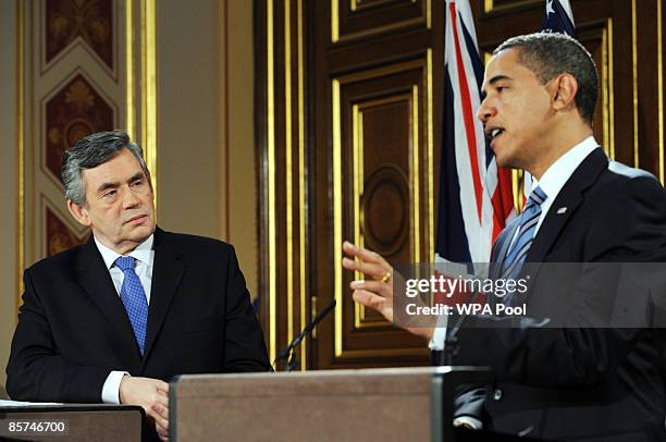 Britain's Prime Minister Gordon Brown listens as US President Barack Obama speaks during a press conference at the Foreign and Commonwealth Office on...