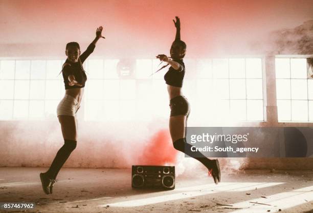 dancing in red smoke - warehouse jump work in joy stock pictures, royalty-free photos & images