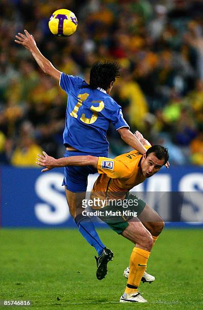 Richard Garcia of the Socceroos and Sakhob Jurayev of Uzbekistan compete for a header during the 2010 FIFA World Cup qualifying match between the...