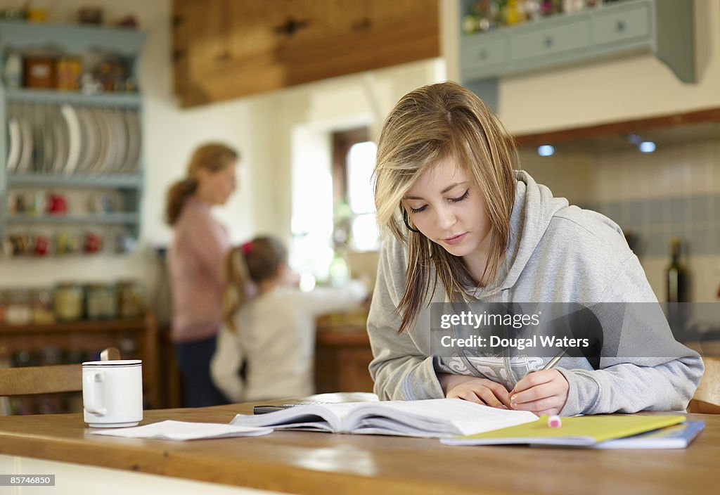 Young student doing homework.