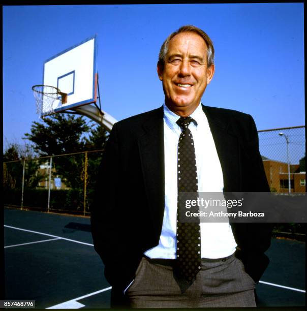 Portrait of American educational administrator University of Kentucky athletic director Charles Martin 'CM' Newton as he poses on a basketball court...