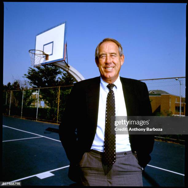 Portrait of American educational administrator University of Kentucky athletic director Charles Martin 'CM' Newton as he poses on a basketball court...