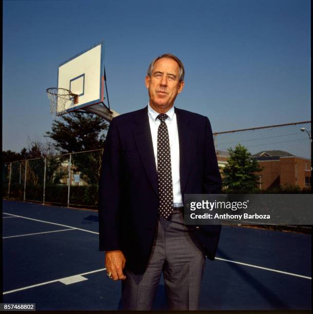 Portrait of American educational administrator University of Kentucky athletic director Charles Martin 'CM' Newton as he poses on a basketball court...
