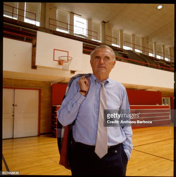 Portrait of American basketball coach Winfrey 'Wimp' Sanderson, of the University of Alabama, as he stand on the court in the university's Foster...