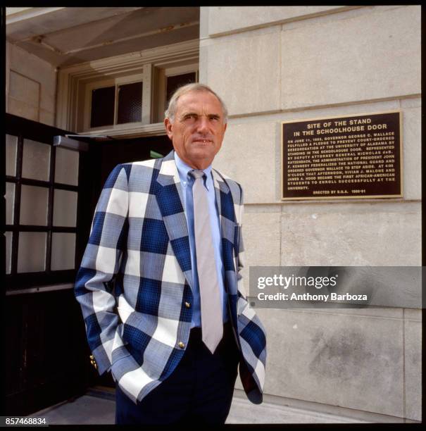 Portrait of American basketball coach Winfrey 'Wimp' Sanderson, of the University of Alabama, as he poses outside the university's Foster Auditorium,...