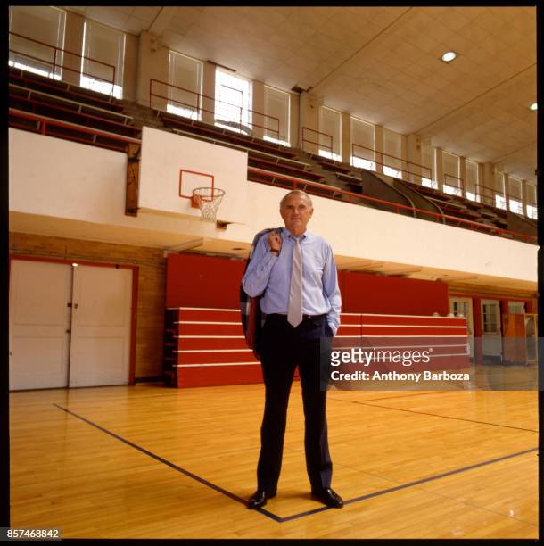 Portrait of American basketball coach Winfrey 'Wimp' Sanderson, of the University of Alabama, as he stand on the court in the university's Foster...