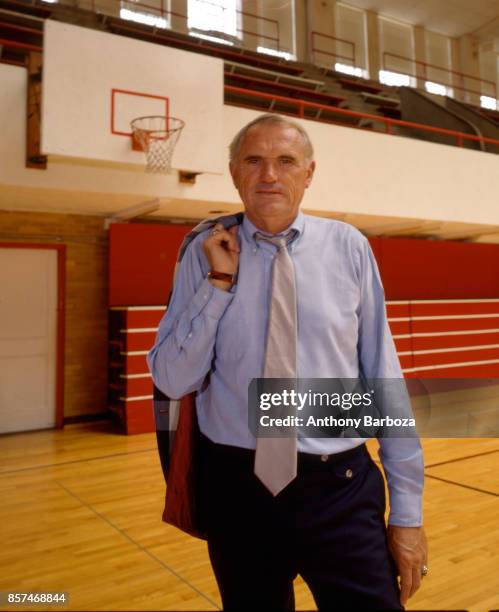 Portrait of American basketball coach Winfrey 'Wimp' Sanderson, of the University of Alabama, as he stand on the court in the university's Foster...