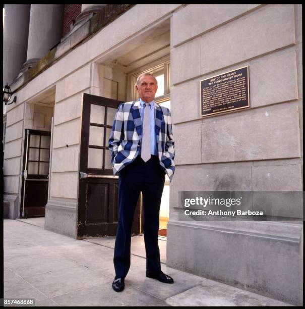 Portrait of American basketball coach Winfrey 'Wimp' Sanderson, of the University of Alabama, as he poses outside the university's Foster Auditorium,...