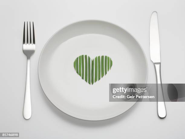 chives arranged in a heart shape on plate - silverware stock pictures, royalty-free photos & images