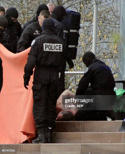 Police officers arrest a man who was threatening to immolate himself by fire on April 1st, 2009 at the European human rights courts in Strasbourg,...