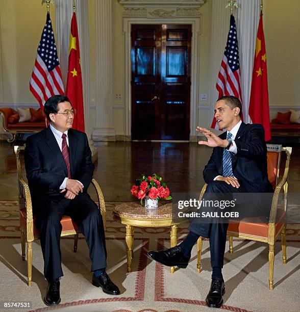 President Barack Obama meets with Chinese President Hu Jintao during meetings at the Winfield House, the US Ambassador's residence in London,...