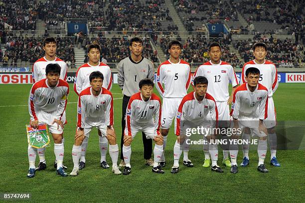 North Korean national football team players pose for a photo before a football match of the FIFA World Cup Asian qualifiers against South Korea at...