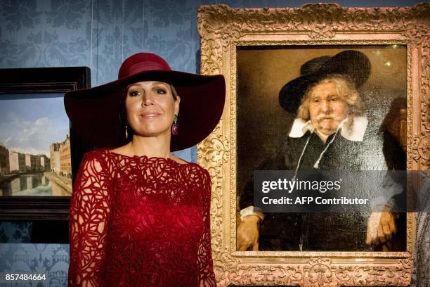 Netherlands Queen Maxima poses as she attends the opening of the travelling exhibition 'Ten masterpieces on tour' in The Mauritshuis Museum in The...