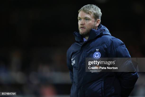 Peterborough United manager Grant McCann looks on during the Checkatrade Trophy match between Peterborough United and Northampton Town at The Abax...