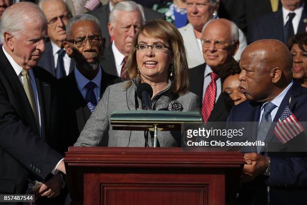 Former Congresswoman and gun violence victim Gabby Giffords is joined by Rep. Mike Thompson , Rep. John Lewis and dozens of fellow Democrats during a...